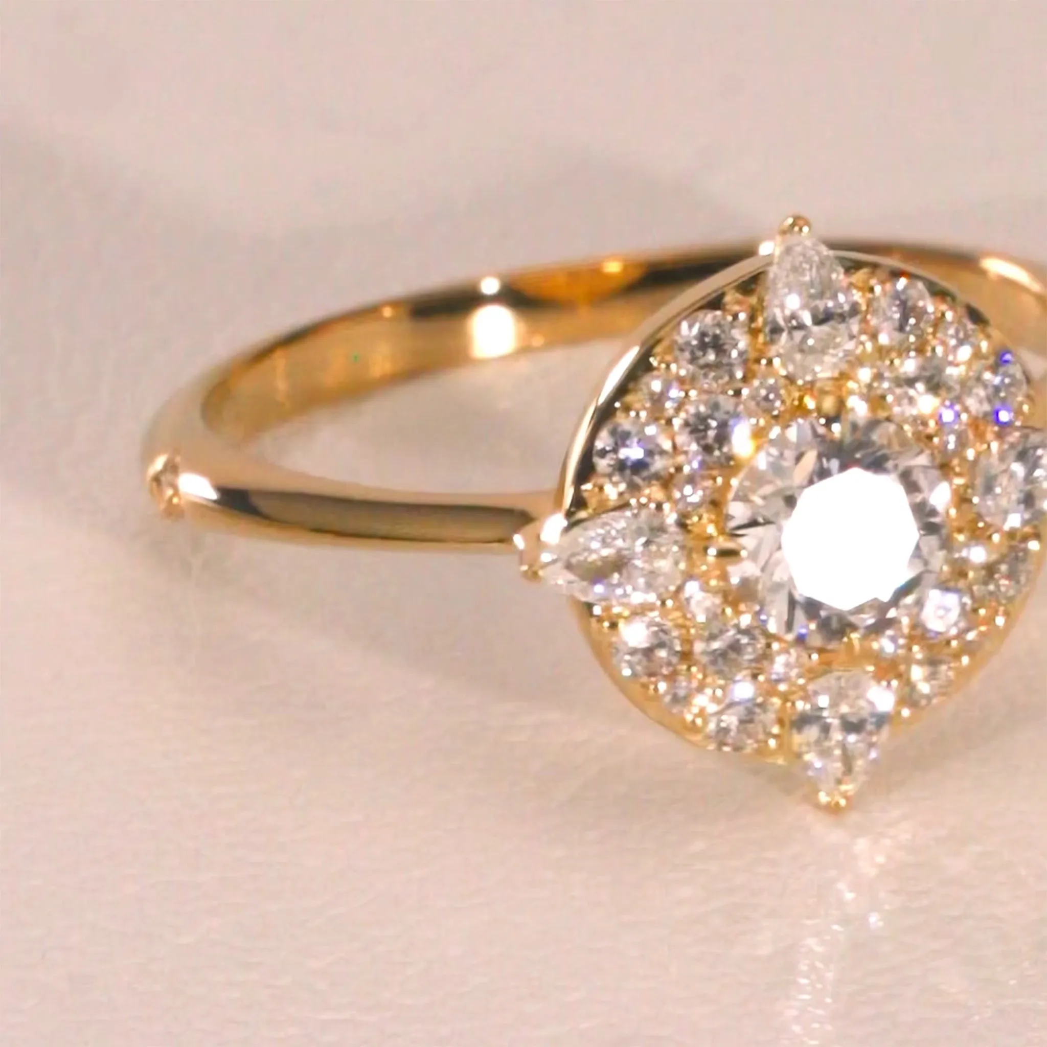 "Points North" Diamond Ring with Round and Pear Shaped Diamonds